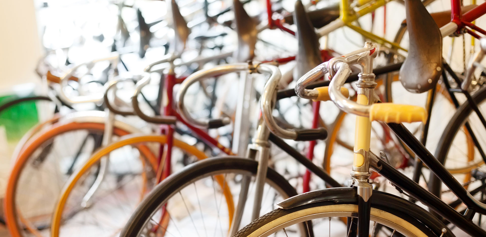 A close up of vintage bicycles side-by-side.