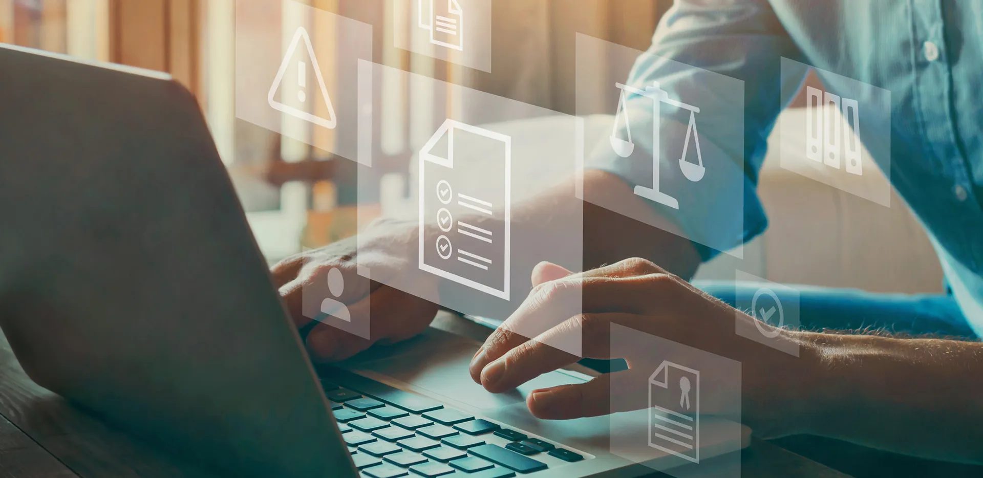 A person typing on their laptop.