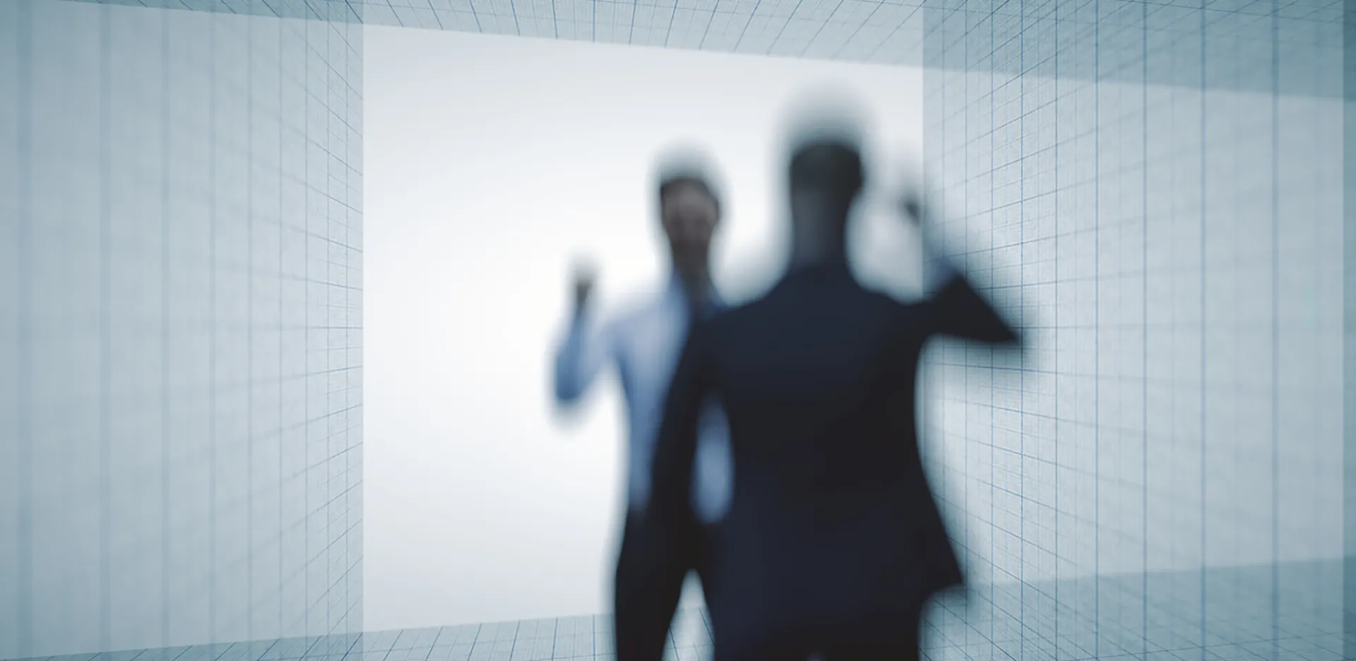 An out-of-focus shot of two professionals arguing.