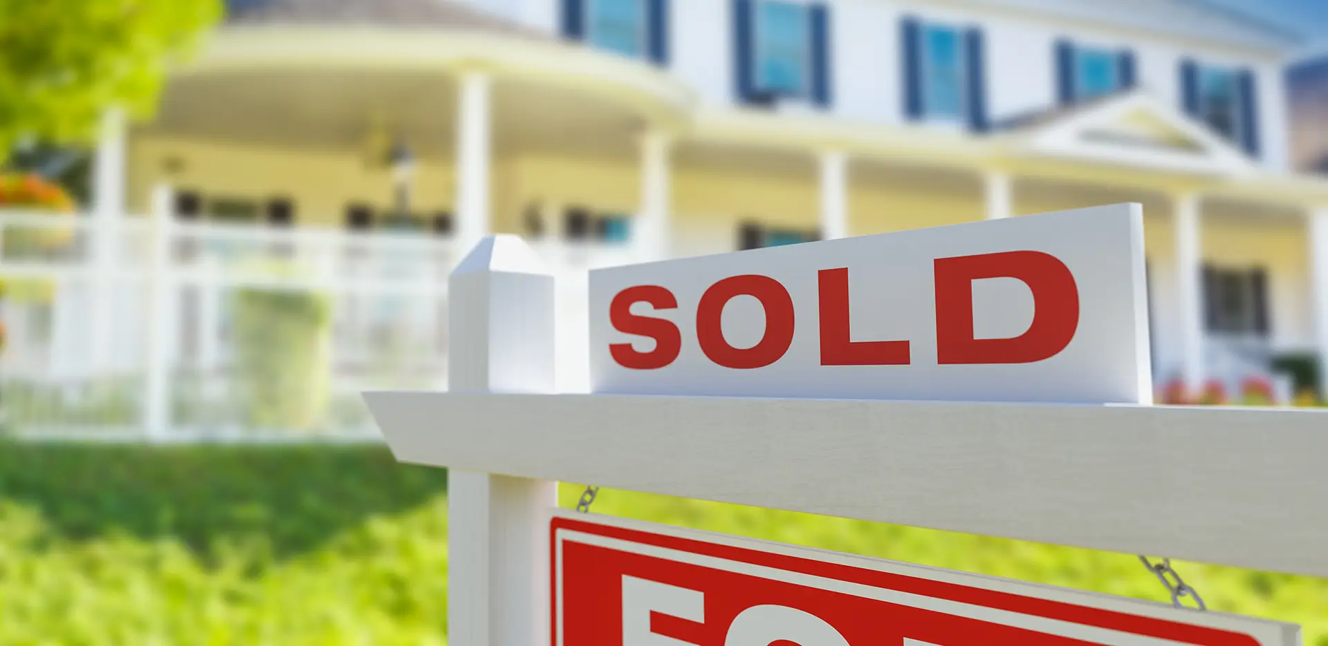 A sold sign in front of a home.