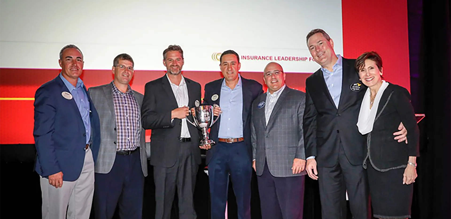 InterWest team members with the National Broker Smackdown Championship Trophy.