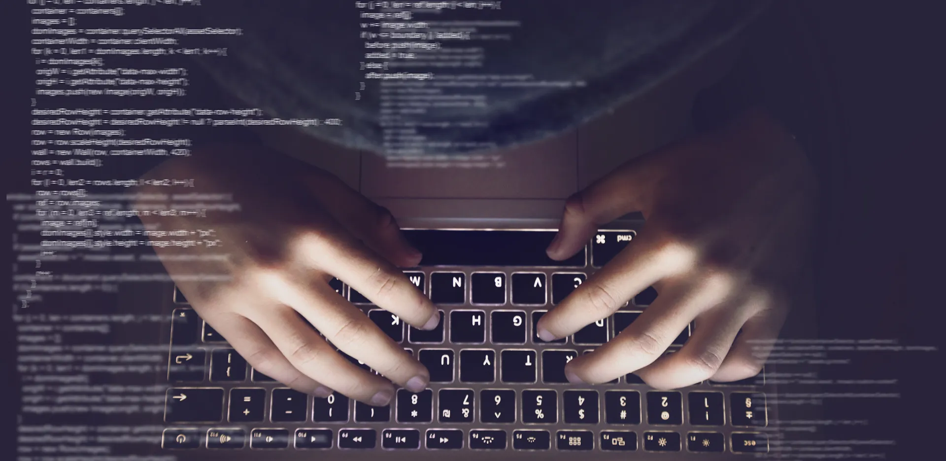 Concept of code with hands typing at a laptop computer in the background.