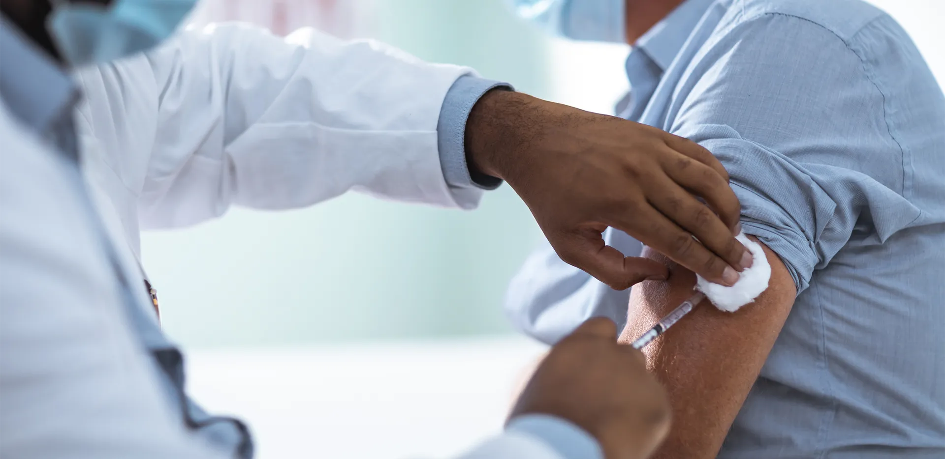 Close-up of someone getting a vaccine.