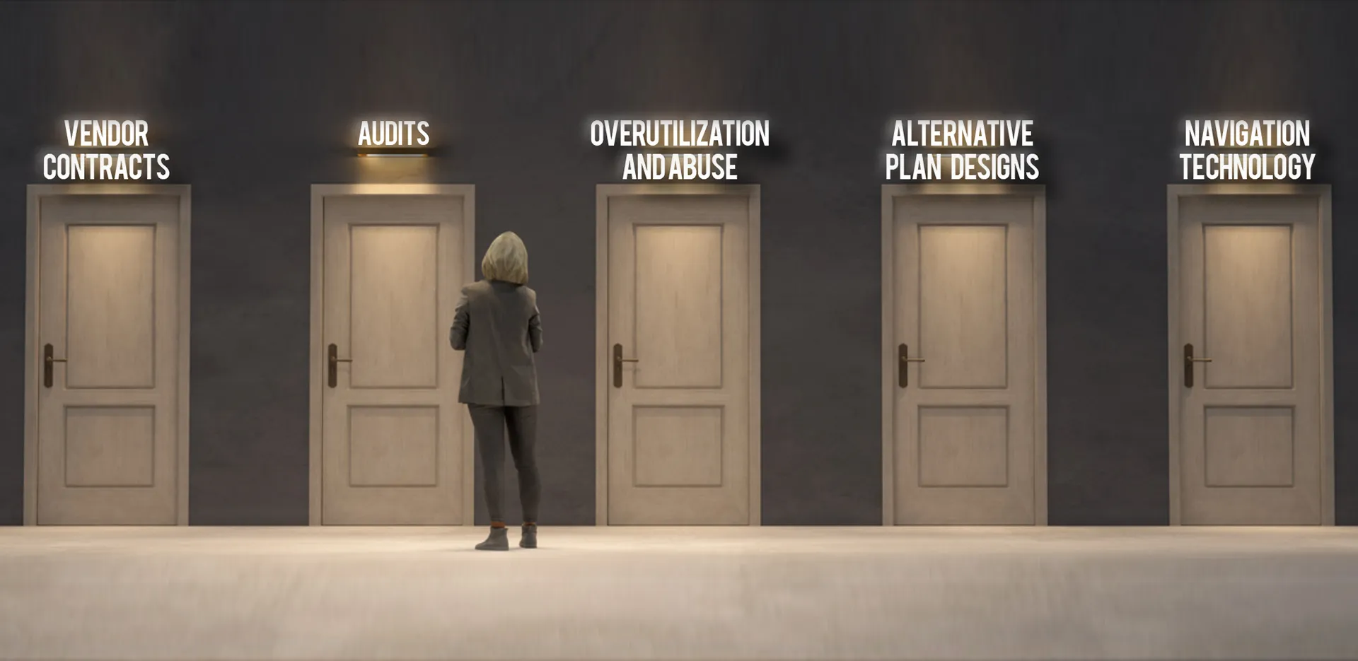 A woman standing in front of a wall lined with doors, each door with a title over it.