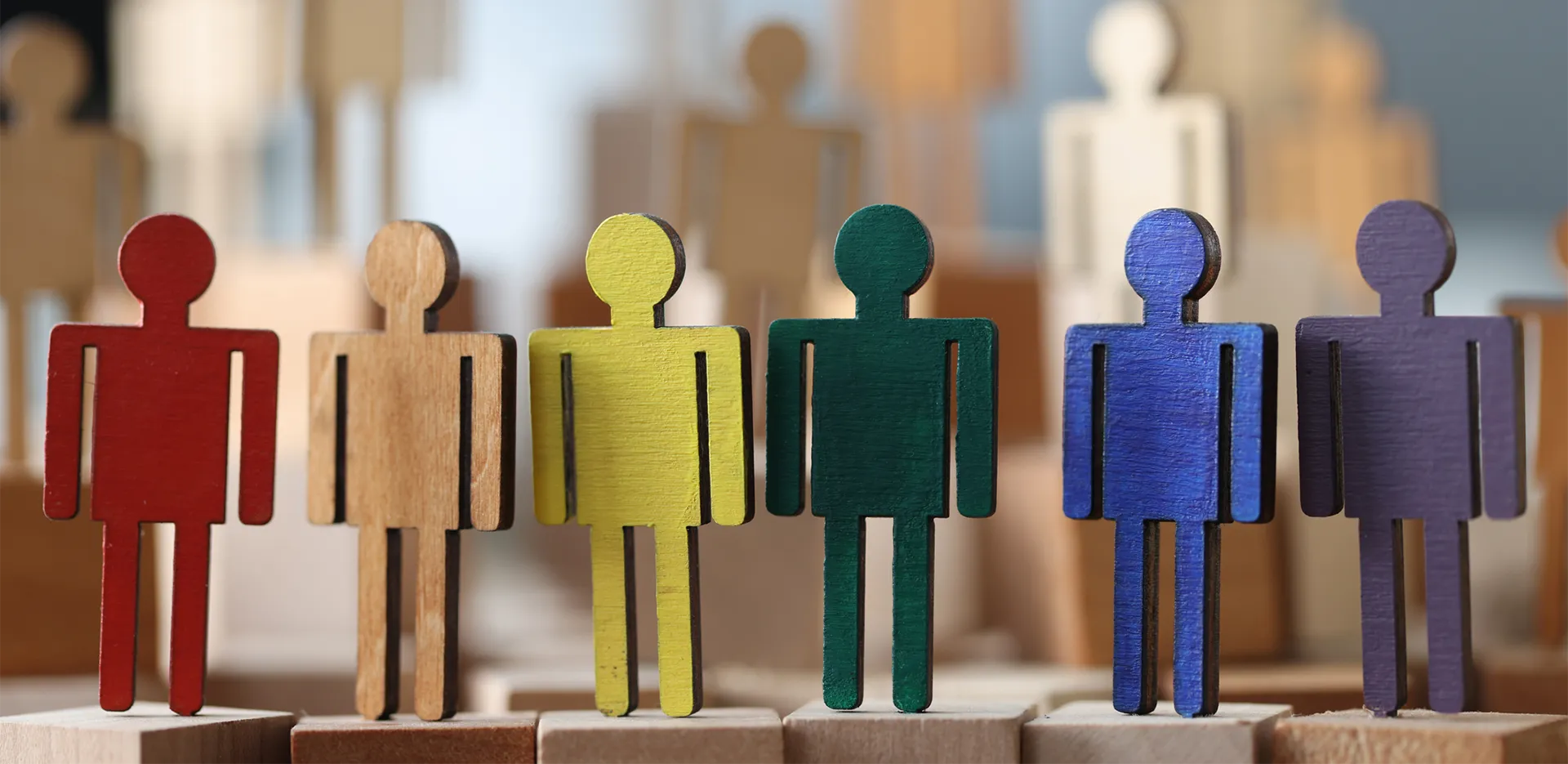 Colorful wooden blocks shaped like people.