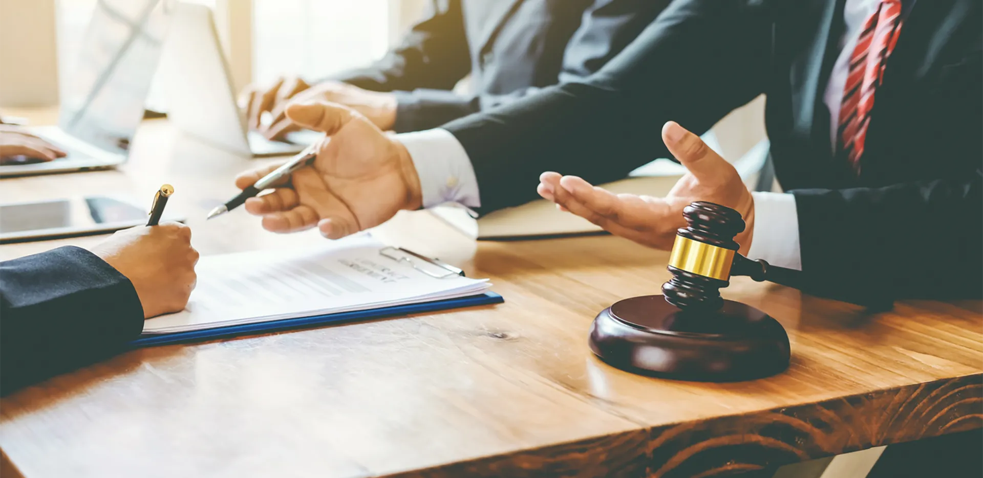 A professional in a suit reviewing important documents.