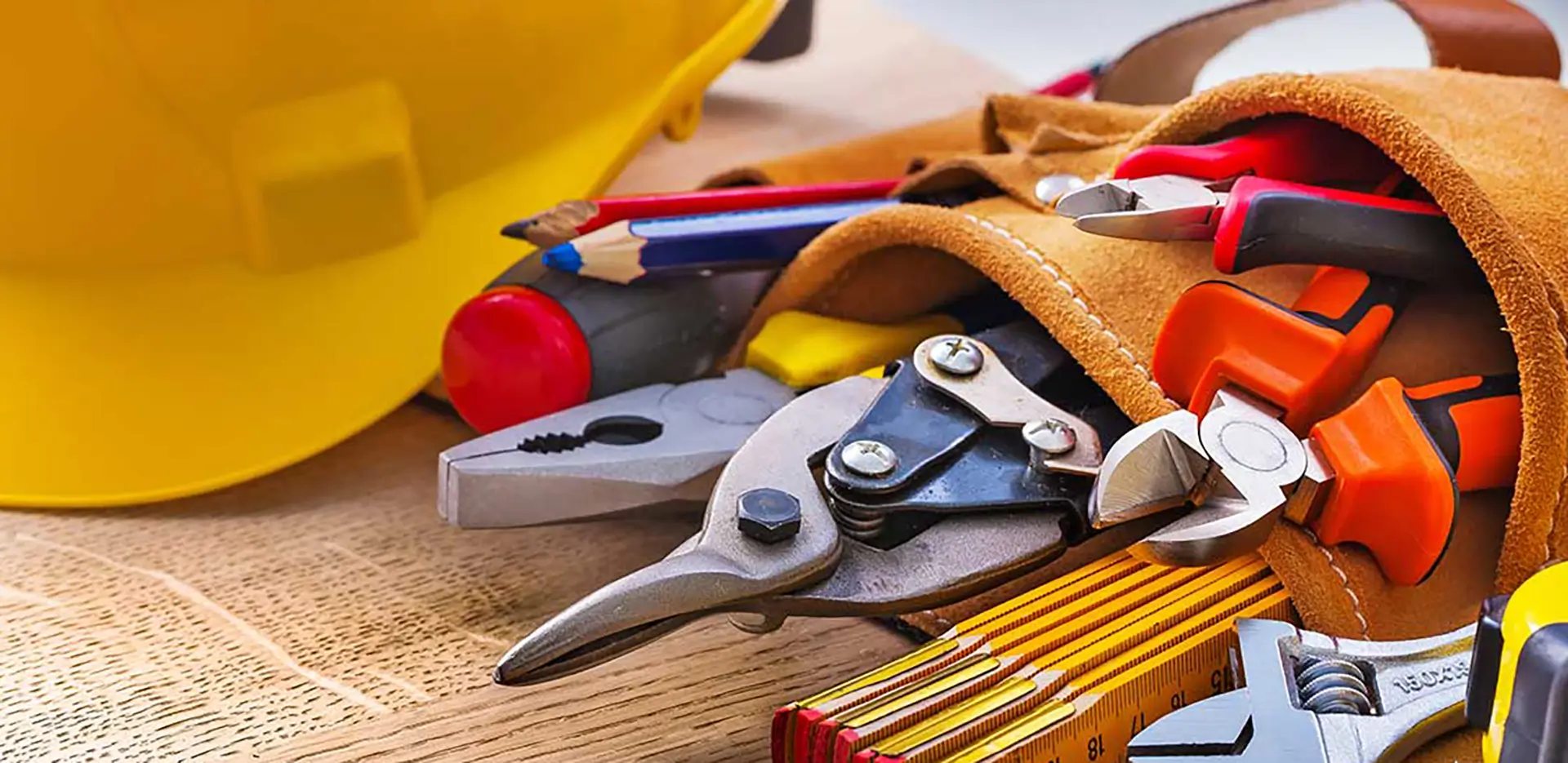 A close-up of tools in a tool belt.