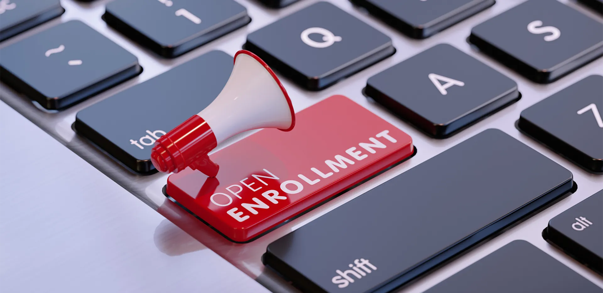 A keyboard with one bright red button reading 'Open Enrollment.' A tiny megaphone rests on top of the button.