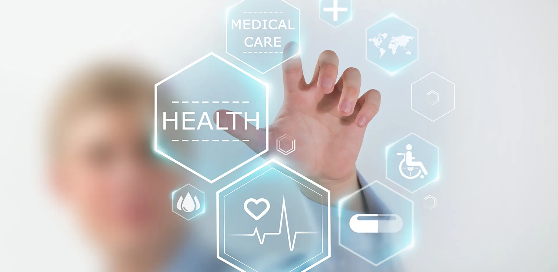 A group of icons representing health care. A hand gestures to two reading 'Health' and 'Medical Care.'