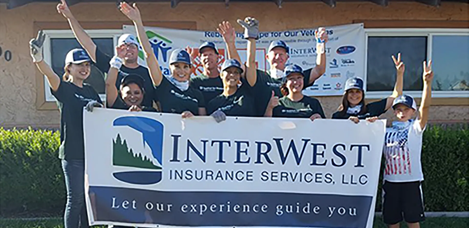 InterWest team members in front of a home under construction.