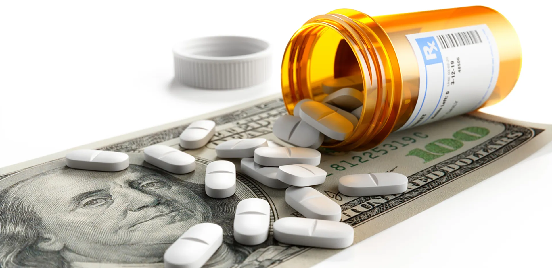 A pile of 100 dollar bills with a stethoscope on top of them.