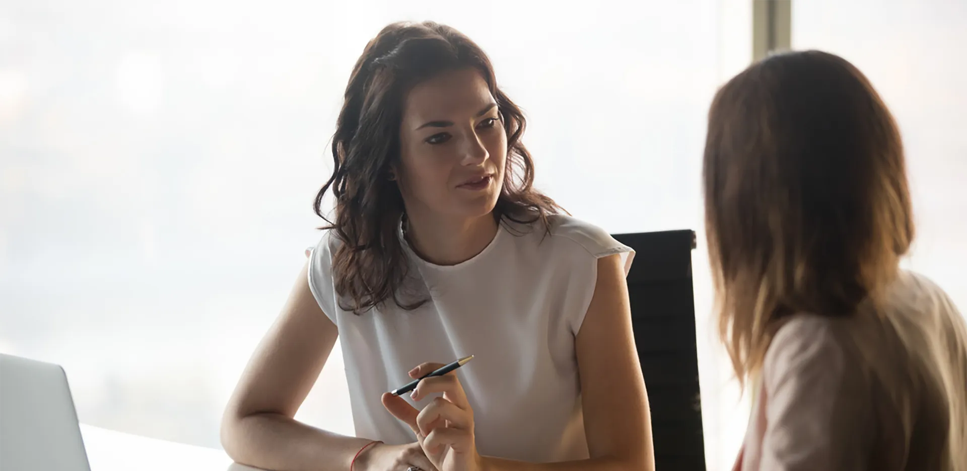 Two professionals discussing healthcare plans.