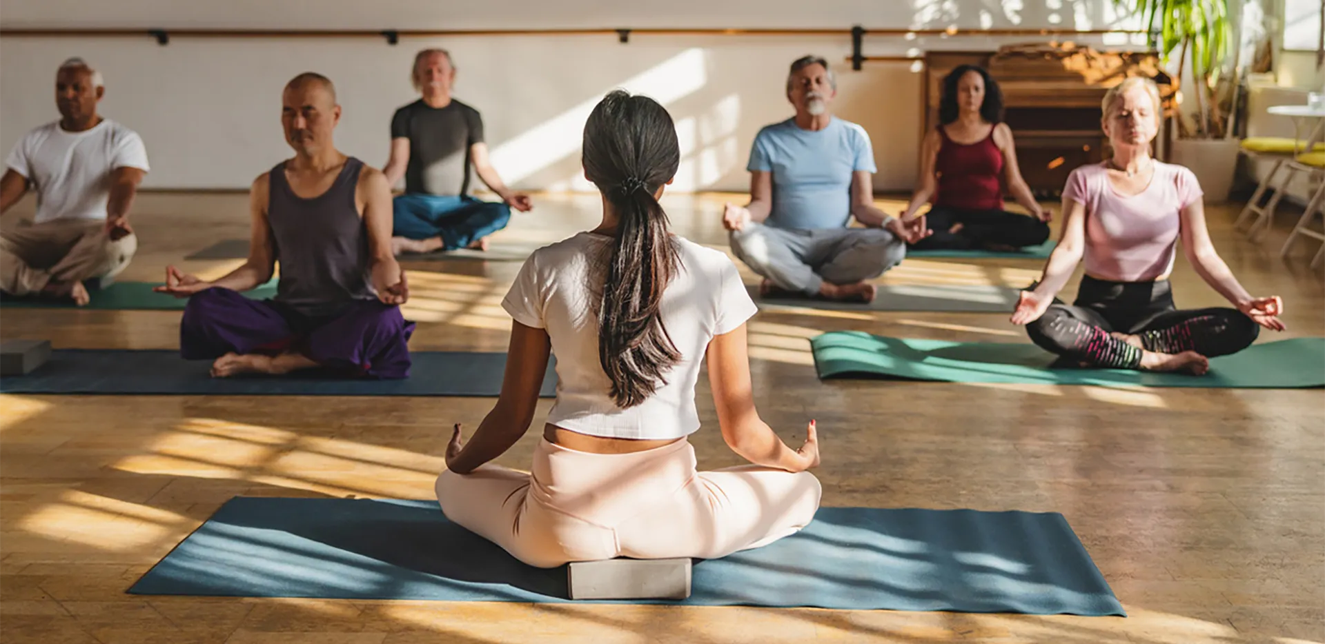 A yoga instructor teaching a class.