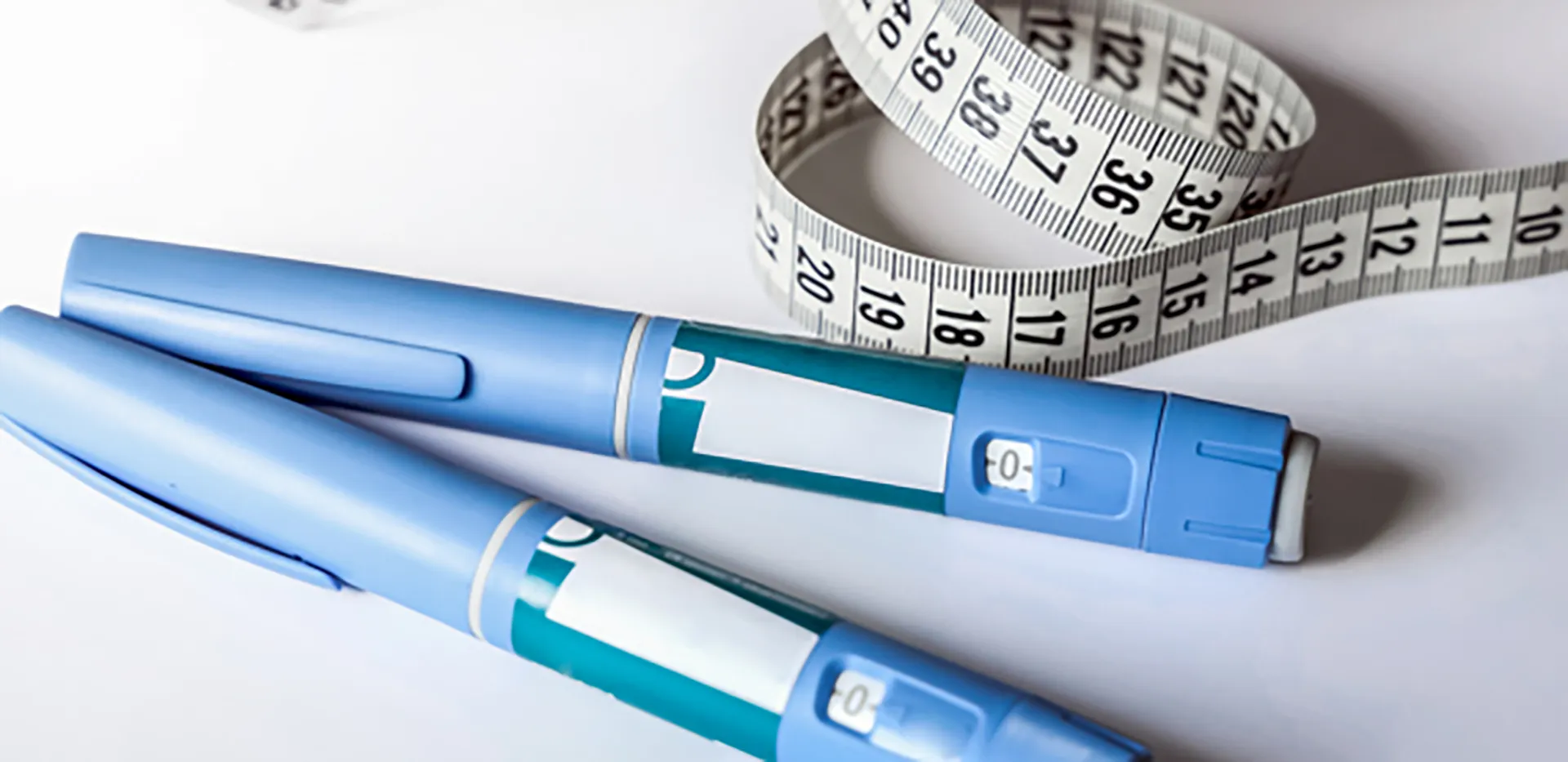 Two Ozempic pens and a tape measure.