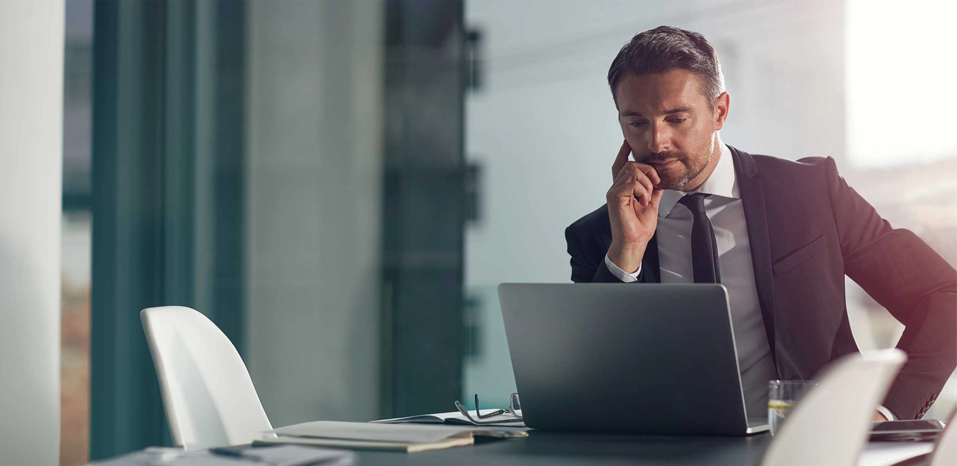 businessman focused, reading his laptop