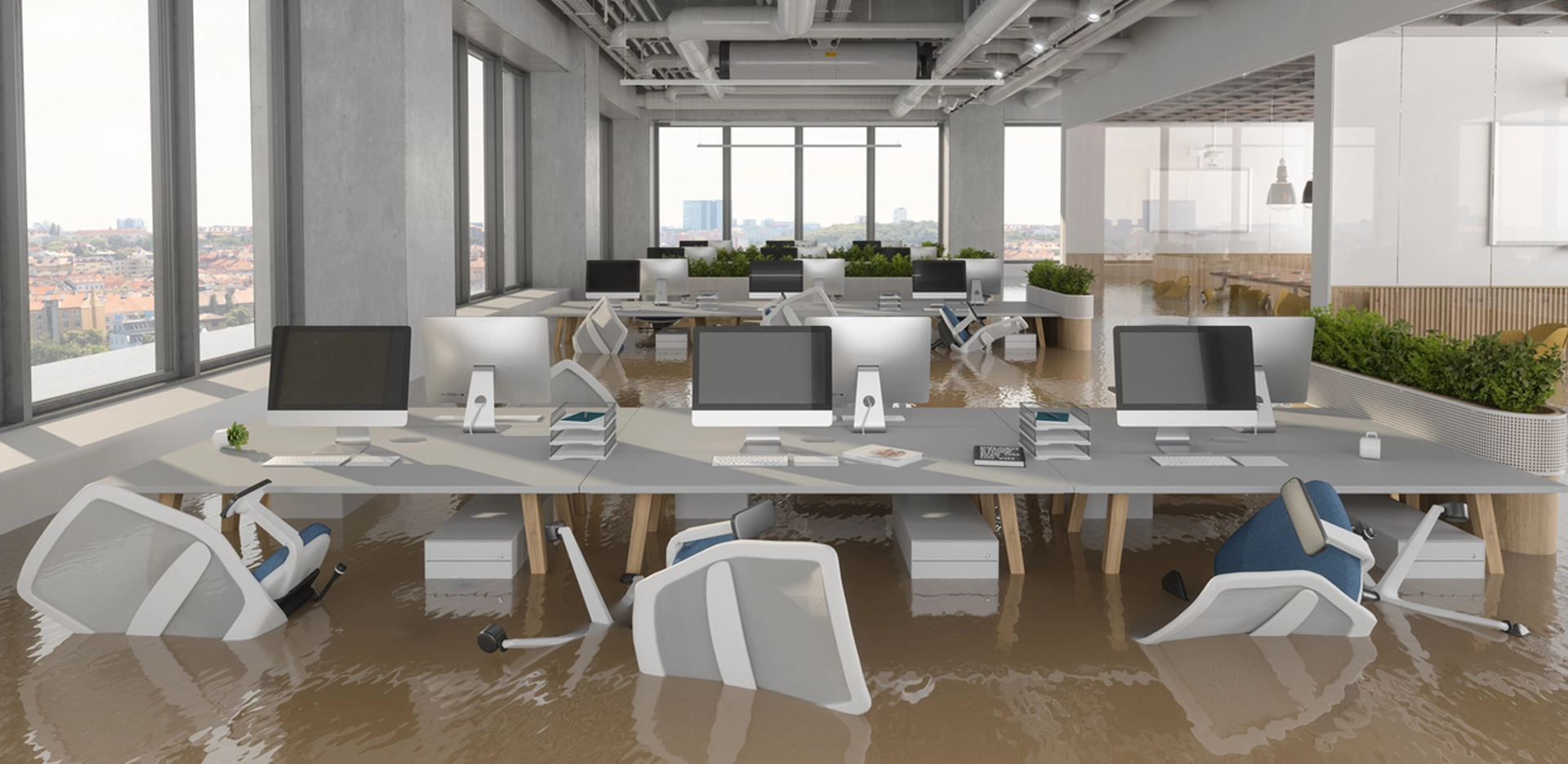 office tables and chairs submerged in flood water