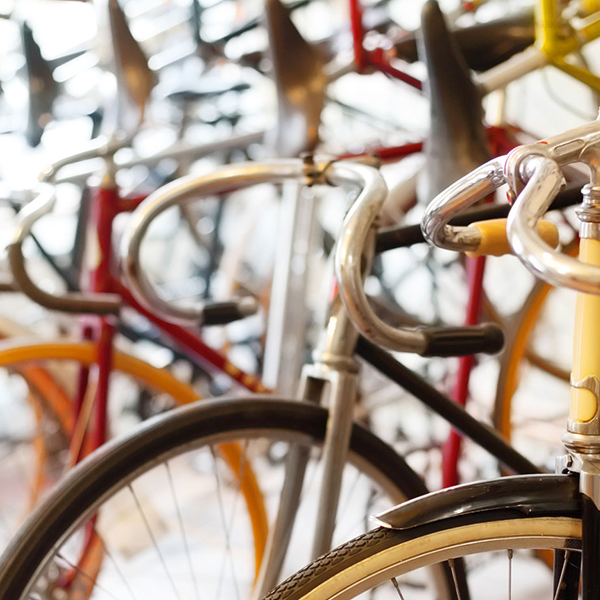 A close up of vintage bicycles side-by-side.