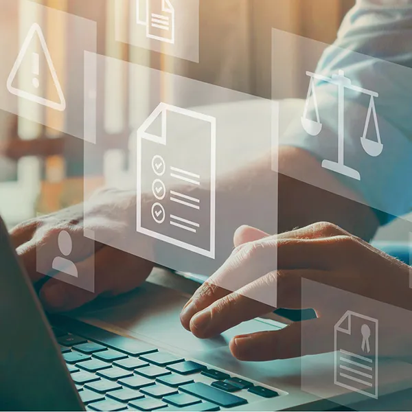 A person typing on their laptop.