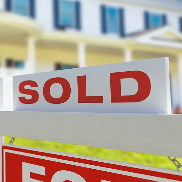 A sold sign in front of a home.