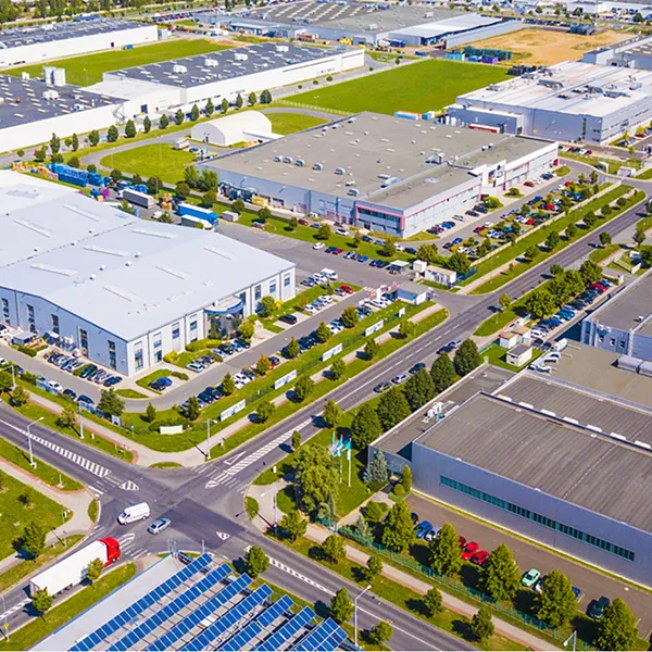 A bird's eye view of a commercial district with office buildings and warehouses.
