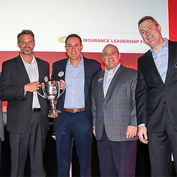 InterWest team members with the National Broker Smackdown Championship Trophy.