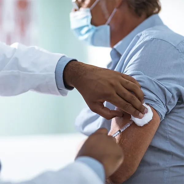 Close-up of someone getting a vaccine.