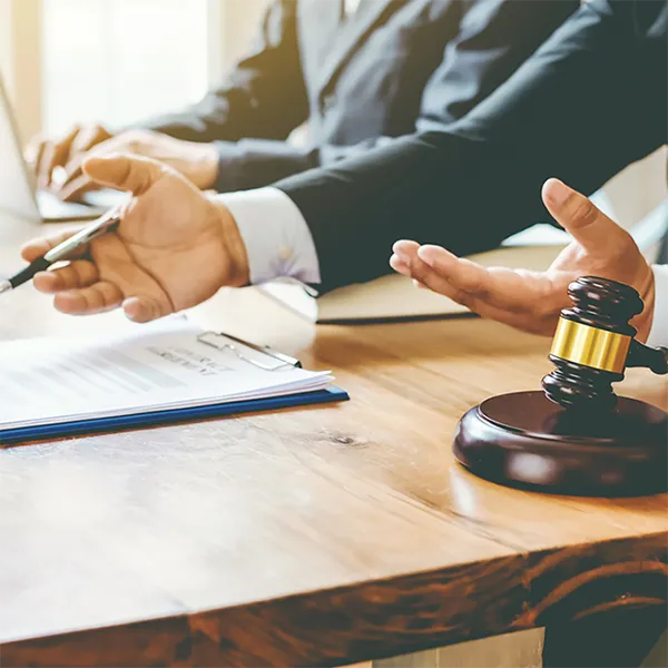 A professional in a suit reviewing important documents.