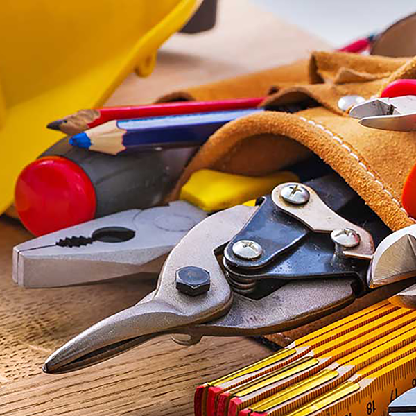 A close-up of tools in a tool belt.