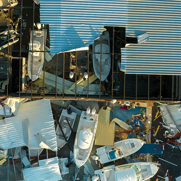 A bird's eye view of a partially-demolished building with a metal roof.