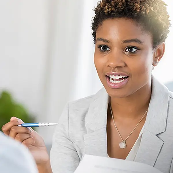 Two professionals discussing a grant.