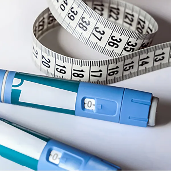 Two Ozempic pens and a tape measure.