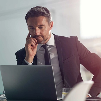 businessman focused, reading his laptop