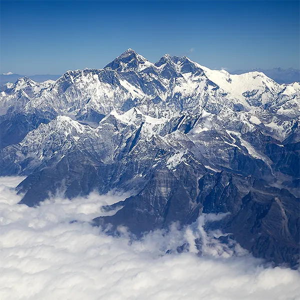Mount Everest surrounded by clouds.