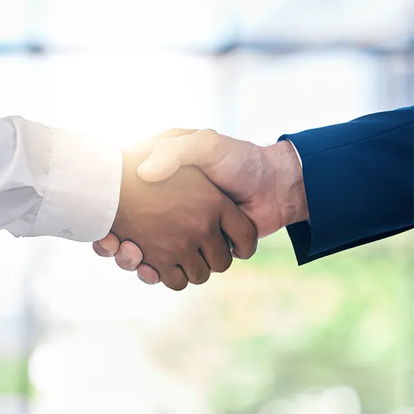 Two professionals shaking hands.