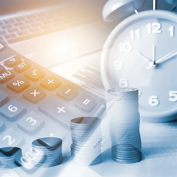 A calculator, an alarm clock, and stacks of coins.