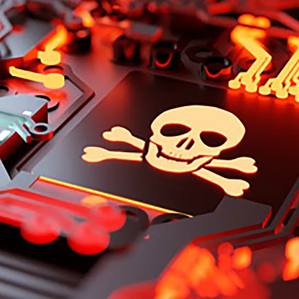 A circuit board lit with red light. In the center is a skull and crossbones.