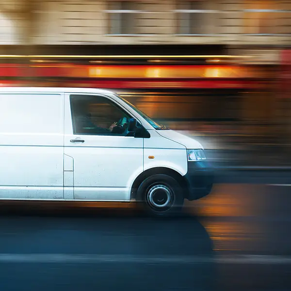 A van driving through the city.