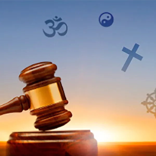 A gavel, sounding block, and courthouse with icons representing different religions in the background.