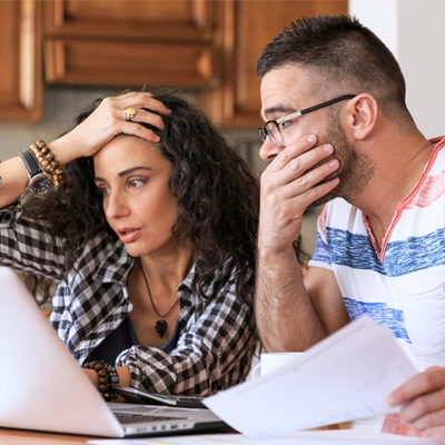 medical bills, couple surprised looking at their medical bill online