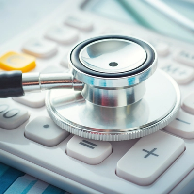stethoscope on calculator