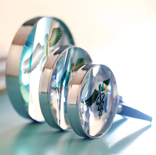 A series of magnifying glasses showing a caduceus staff.