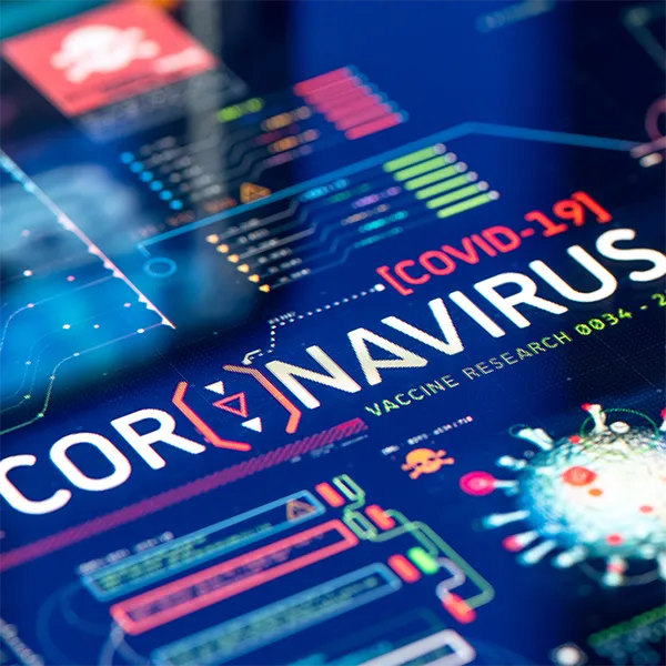 A close-up of a screen reading 'Coronavirus' surrounded by related symbols.