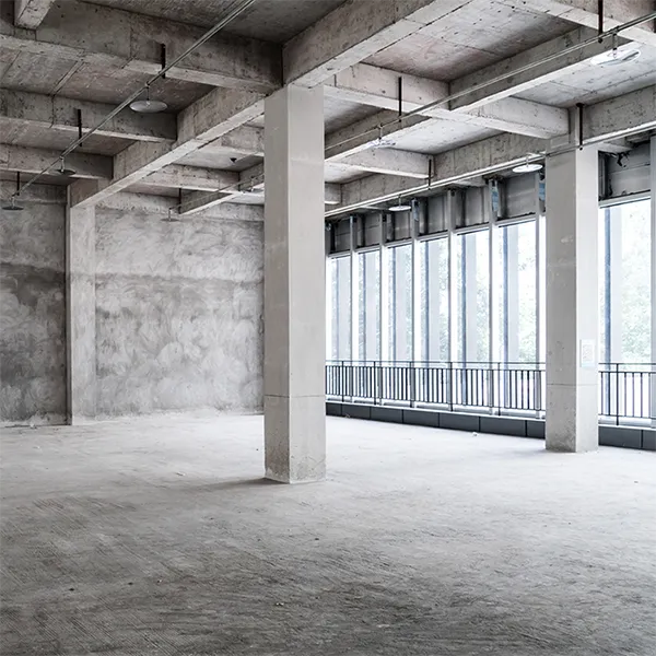 The concrete interior of a vacant building.