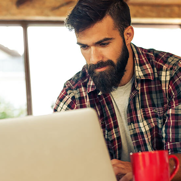 A contractor working on a laptop computer.