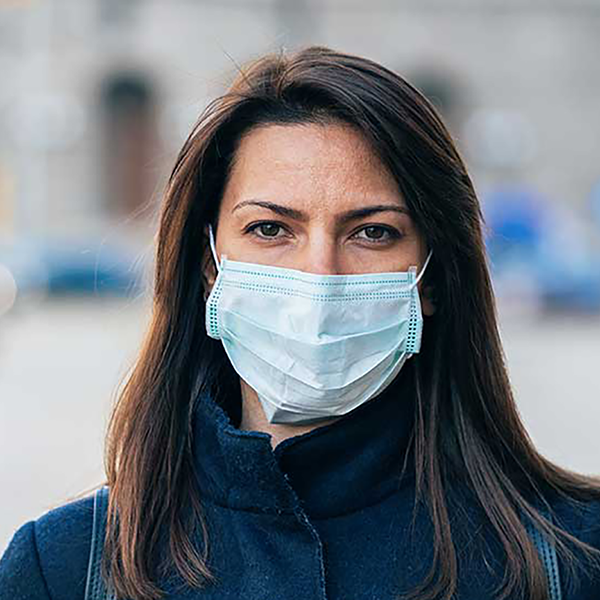 A woman wearing a face mask.