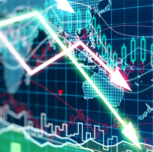 Trend lines pointing down in front of a digital map.