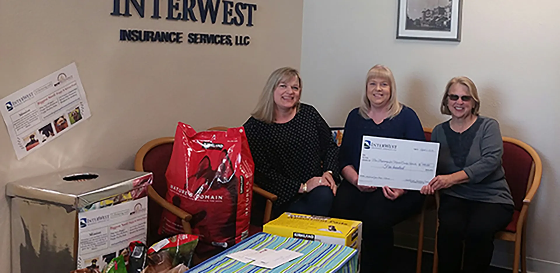 InterWest team members with donations for New Beginnings for Merced County Animals.