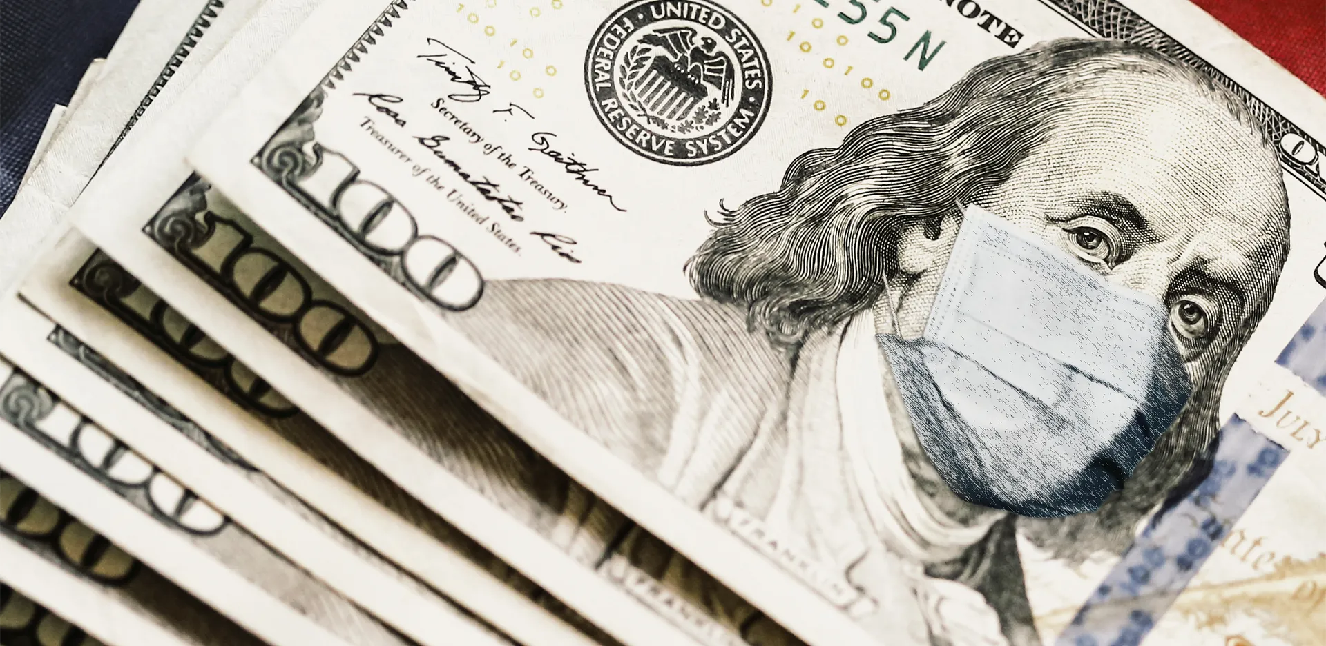 A stack of $100 bills with Ben Franklin wearing a surgical mask.