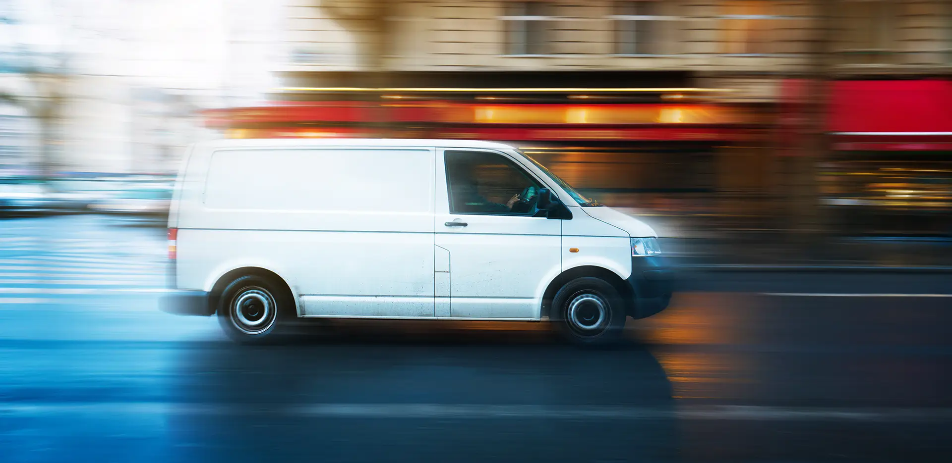 A van driving through the city.