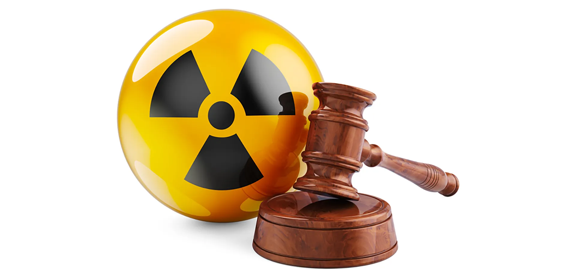 A gavel and sounding block in front of a yellow and black radiation symbol.